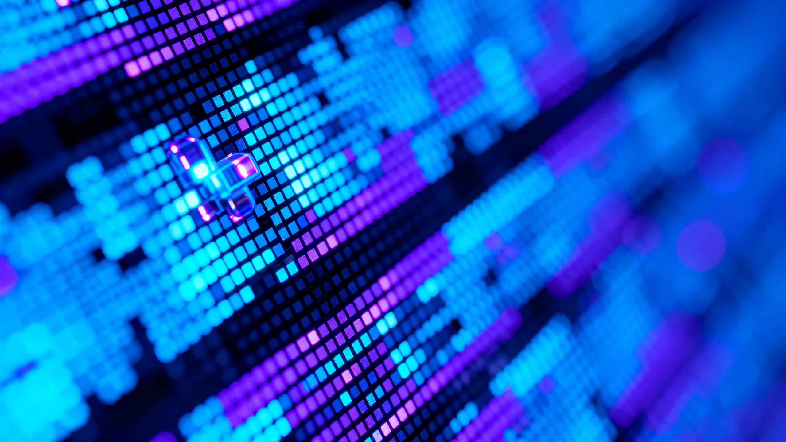 Abstract macro view of a digital screen with glowing blue and purple diodes.
